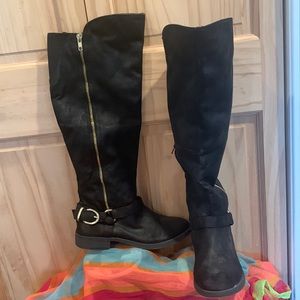 Black knee high boots with gold buckle accent and zipper. Size 7 1/2.